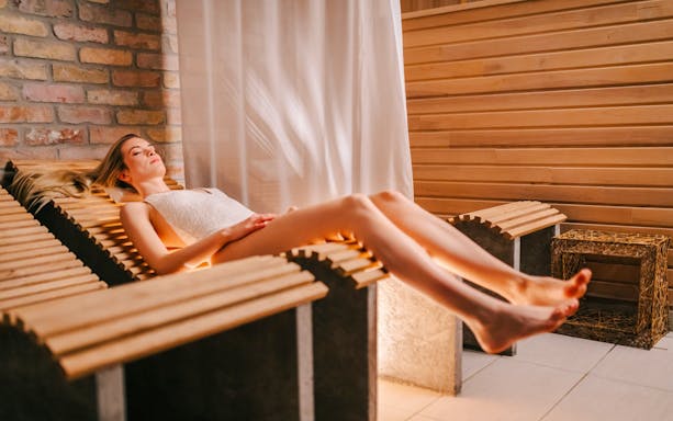 Relaxation at Mandala Day Spa on a heated wooden lounger.