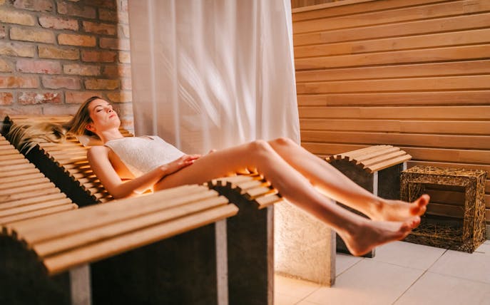 Relaxation at Mandala Day Spa on a heated wooden lounger.