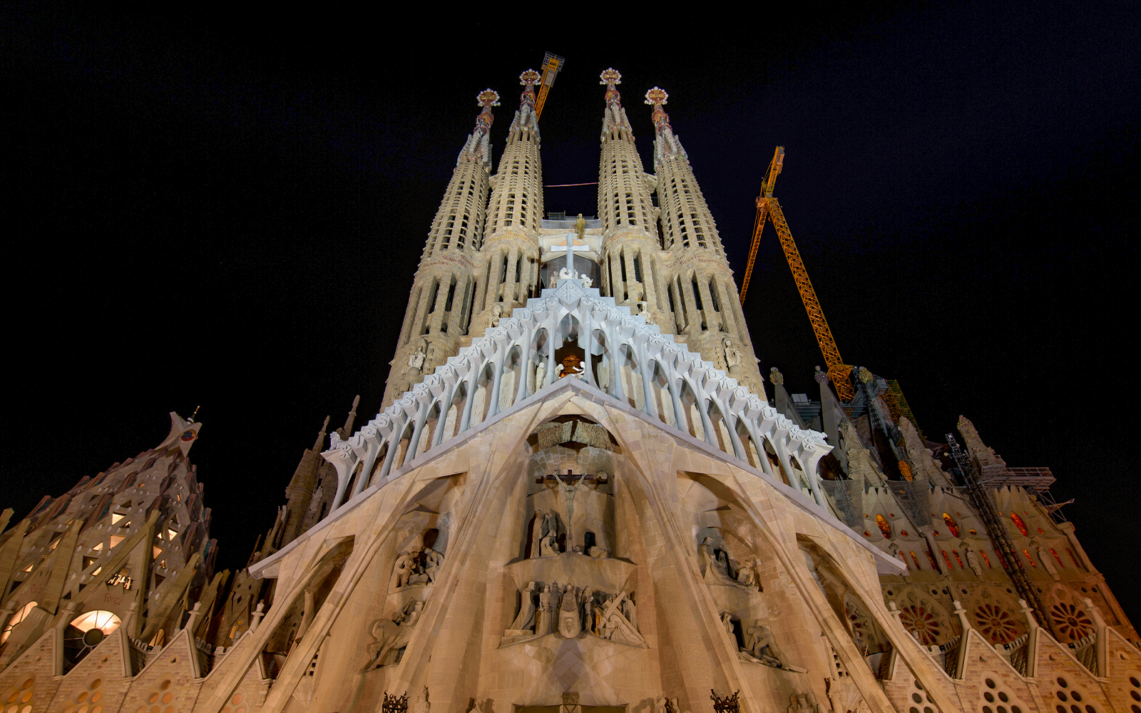 Night view of the Passion Façade of Sagrada Familia in Barcelona.