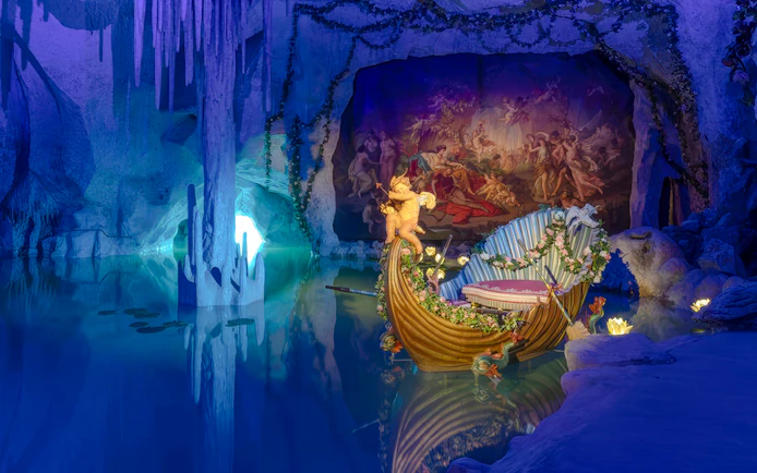 Grotto with ornate boat and mural at Linderhof Palace.