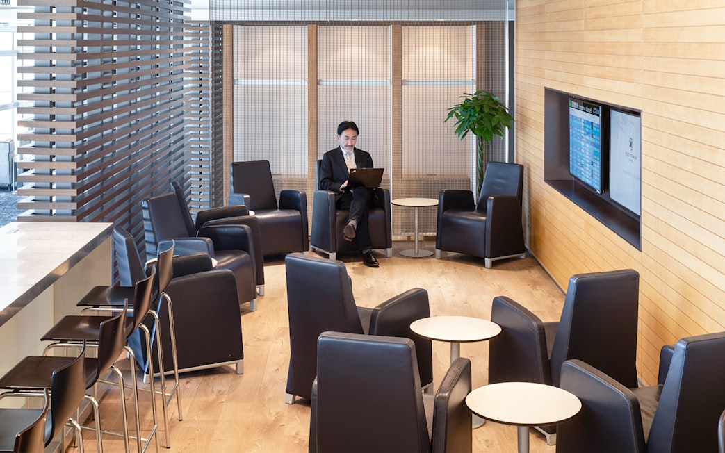 Plaza Premium Lounge seating area at Chubu Centrair International Airport with guest using laptop.