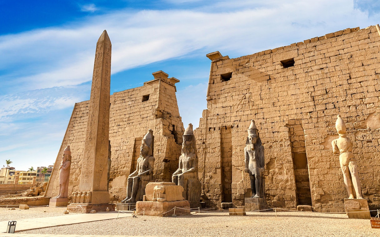 Luxor Temple entrance with obelisk and statues, Egypt.