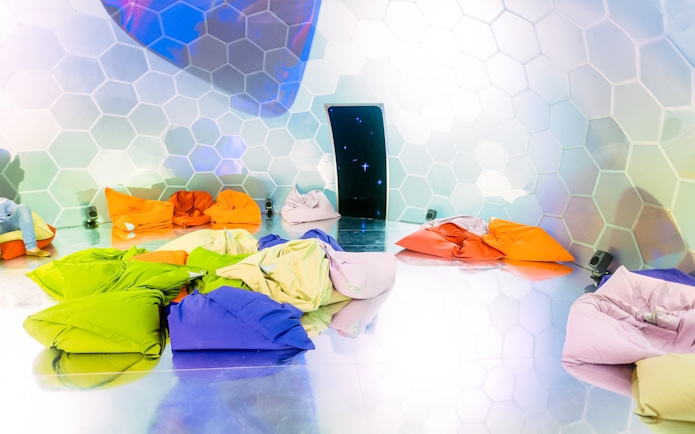 Colorful bean bags in a hexagonal room at Bubble Planet, Washington DC.