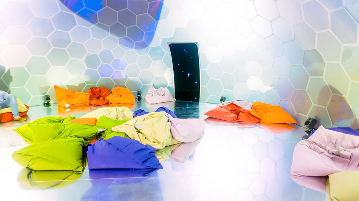 Colorful bean bags in a hexagonal room at Bubble Planet, Washington DC.