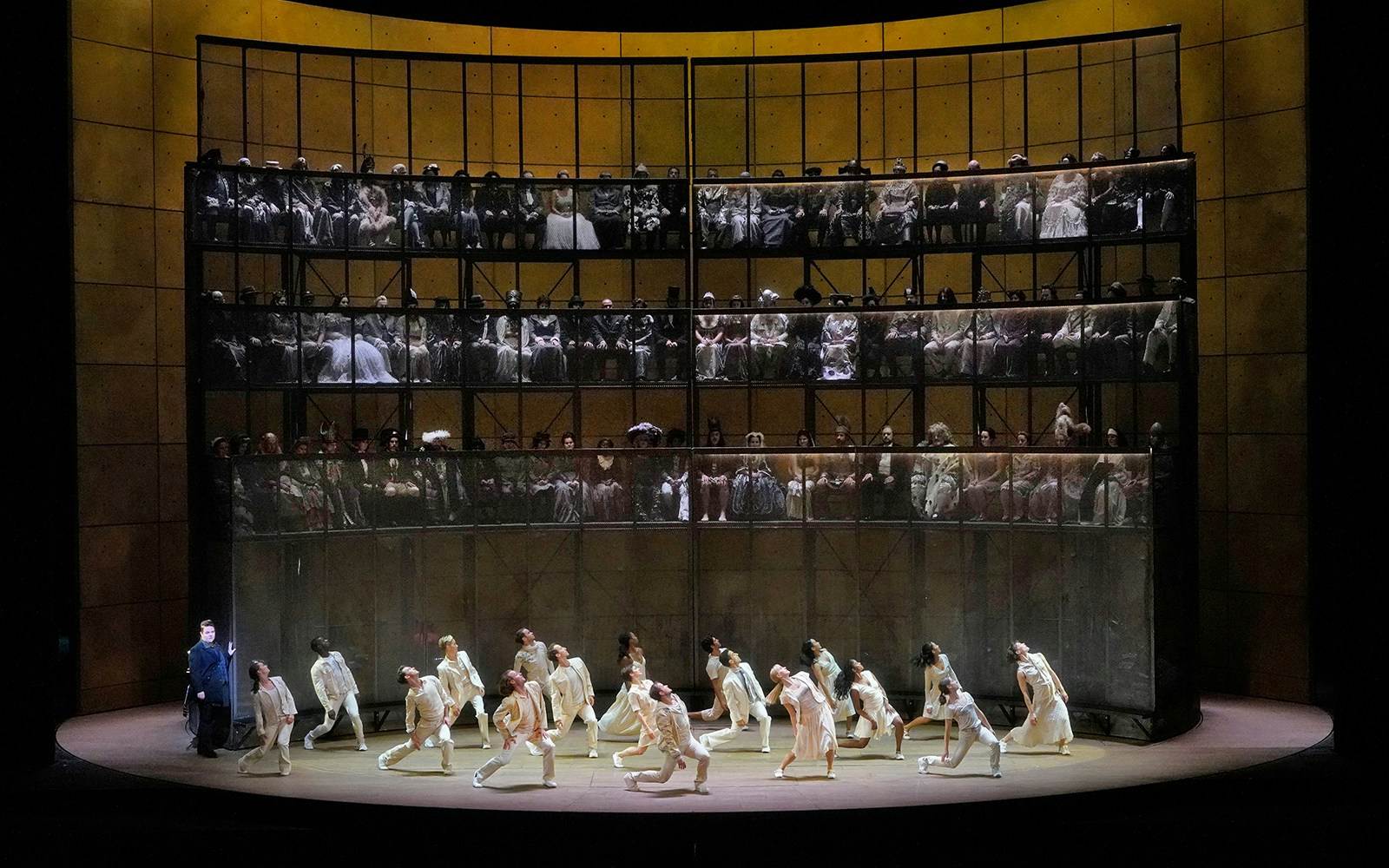 Performers on stage during Orfeo ed Euridice opera with audience in background.