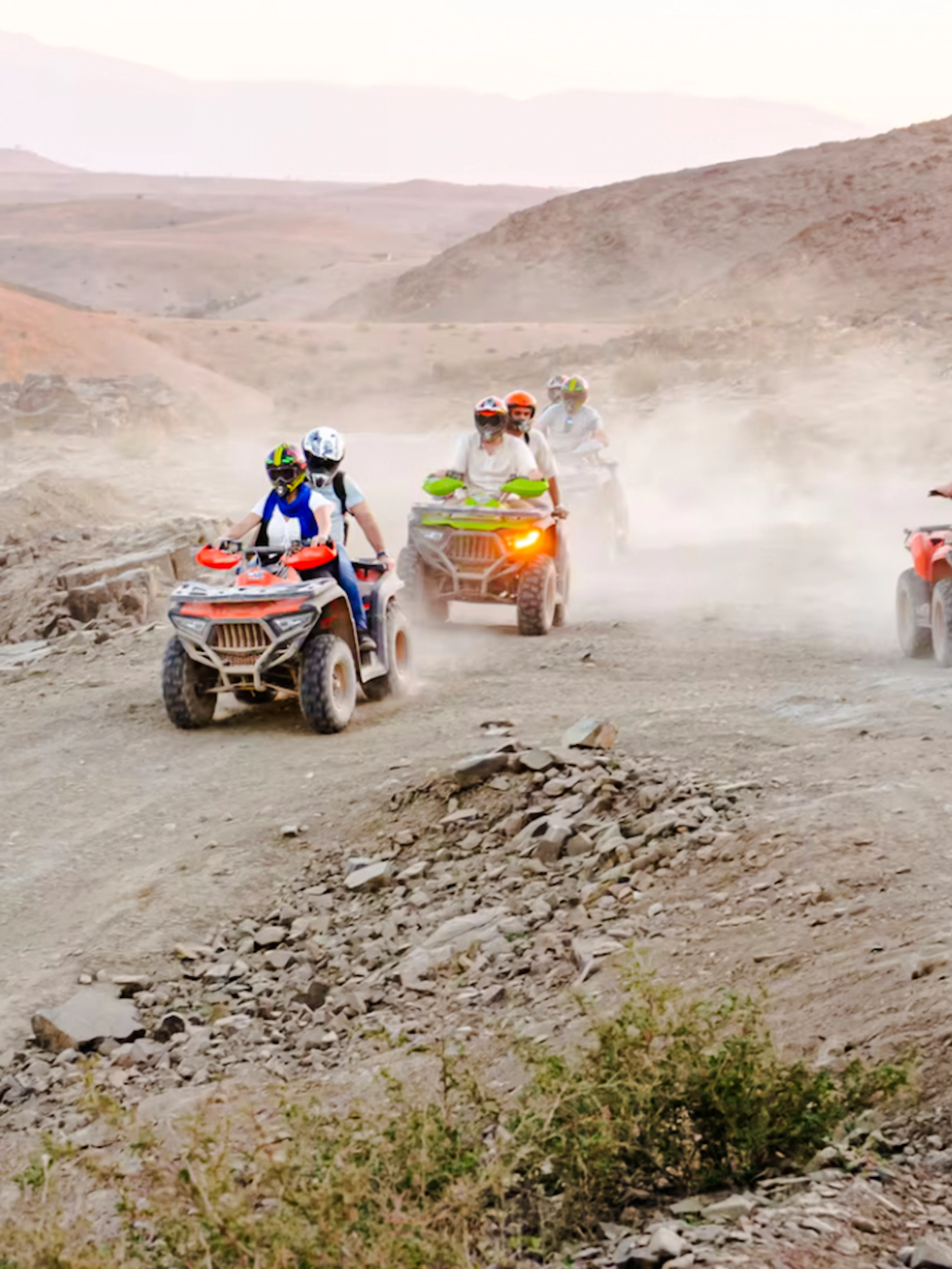 People riding ATVs in Agafay Desert, Marrakesh.