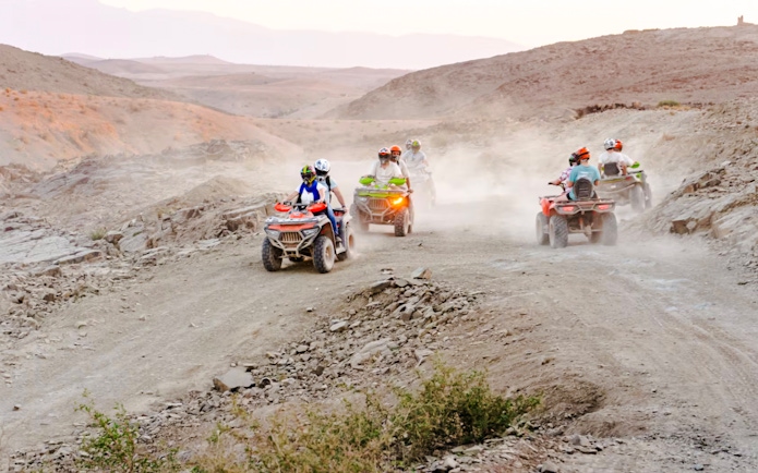 People riding ATVs in Agafay Desert, Marrakesh.