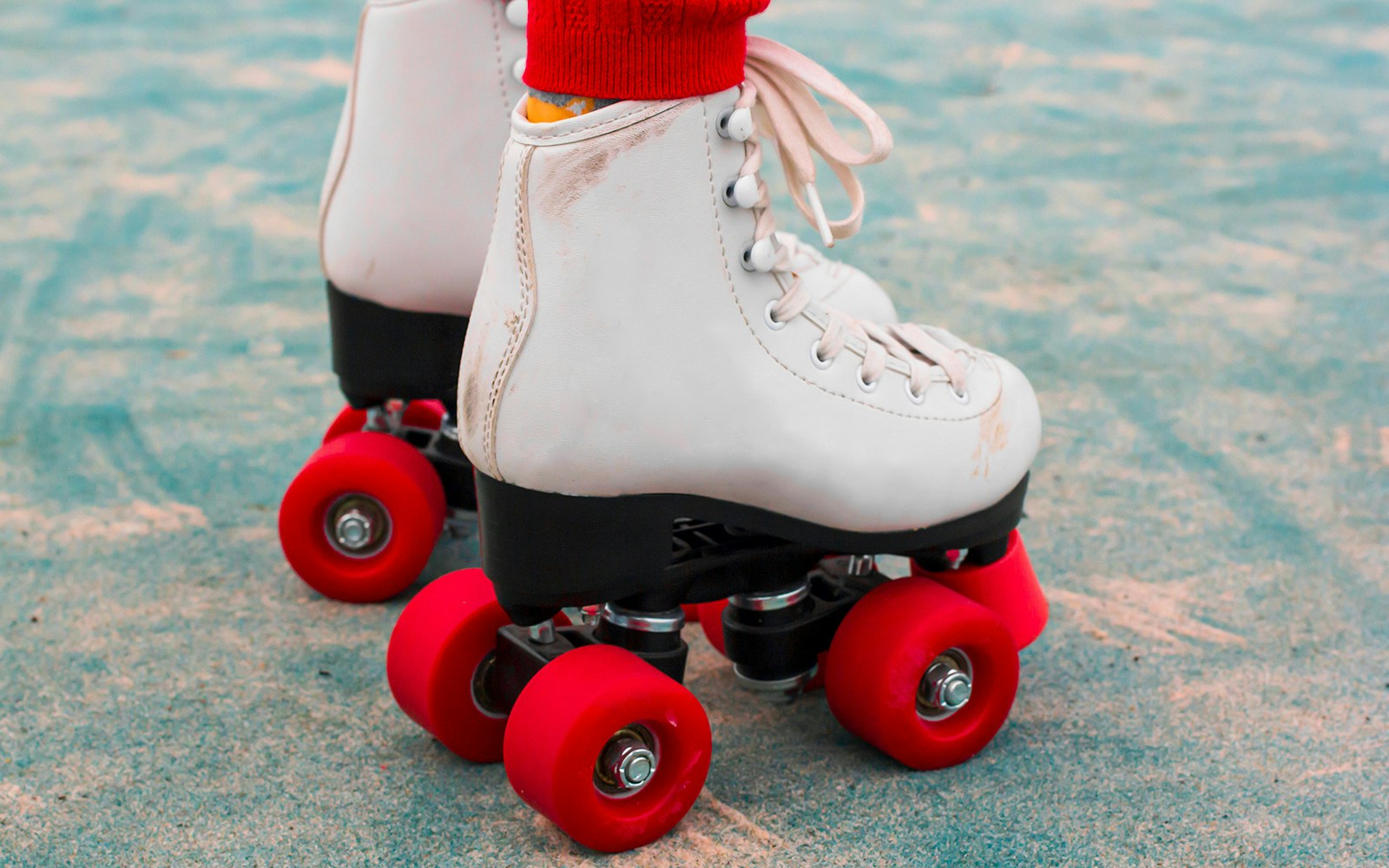Roller skates on pavement, part of Caracas Christmas tradition.