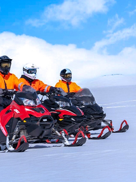 Snowmobile riders on Langjökull Glacier in Iceland.