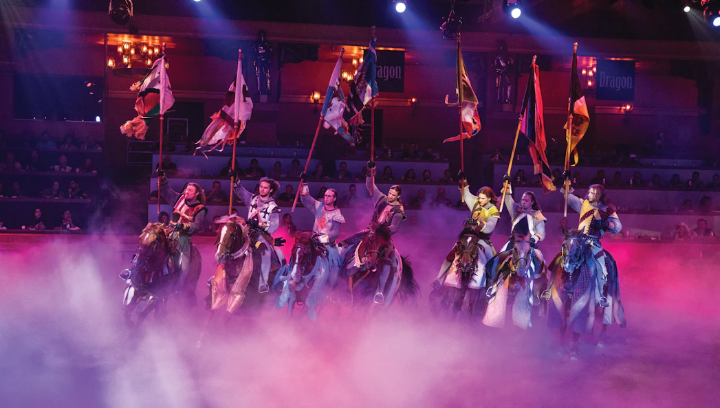 Knights on horseback with flags at Tournament of Kings show in Las Vegas.