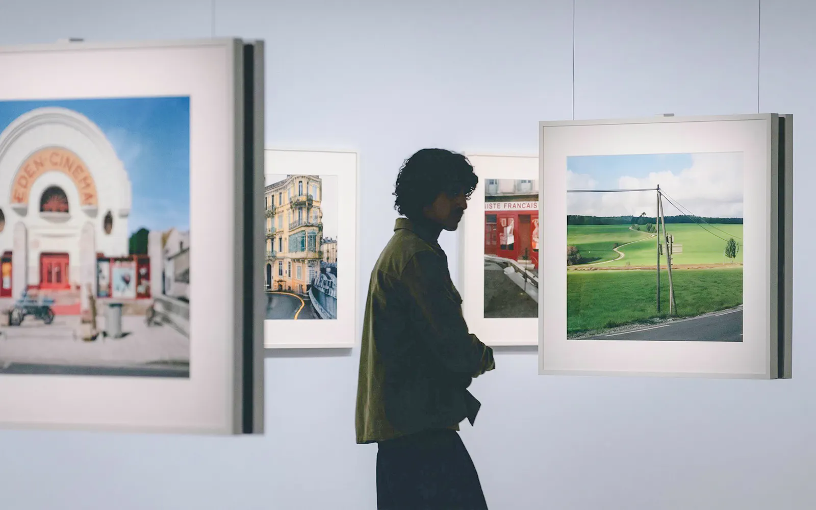 Visitor viewing art at Bourse De Commerce Pinault Collection, Paris.