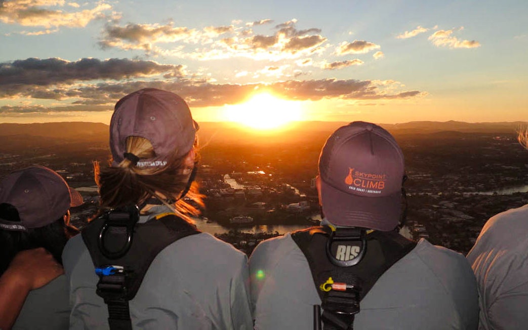 Guests enjoying sunset views from SkyPoint Climb at twilight, Gold Coast.