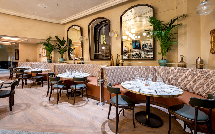 Breakfast setup at Brasserie Rosalie with elegant tables and seating.