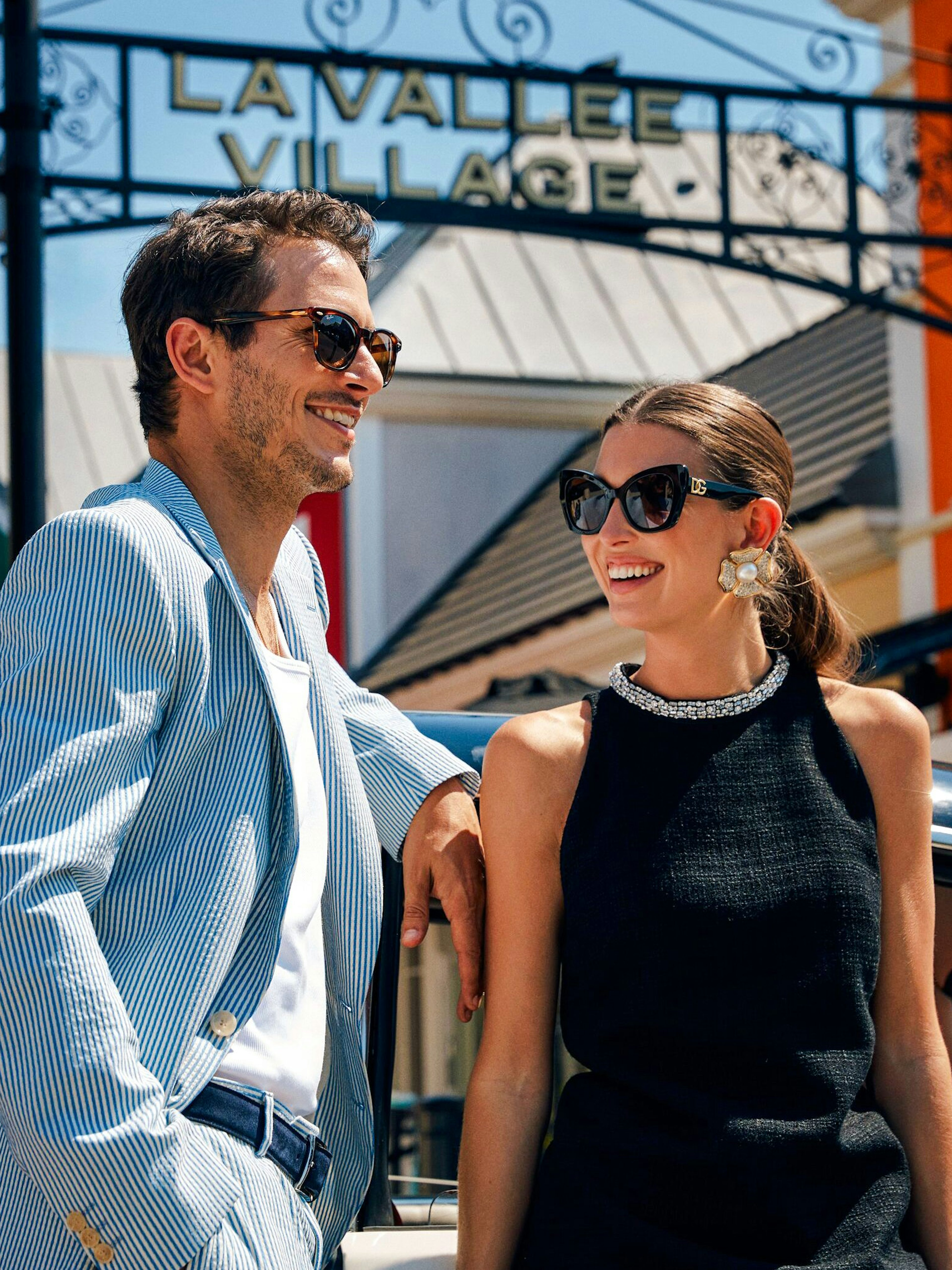 Couple enjoying a day at La Vallée Village, Paris, France.