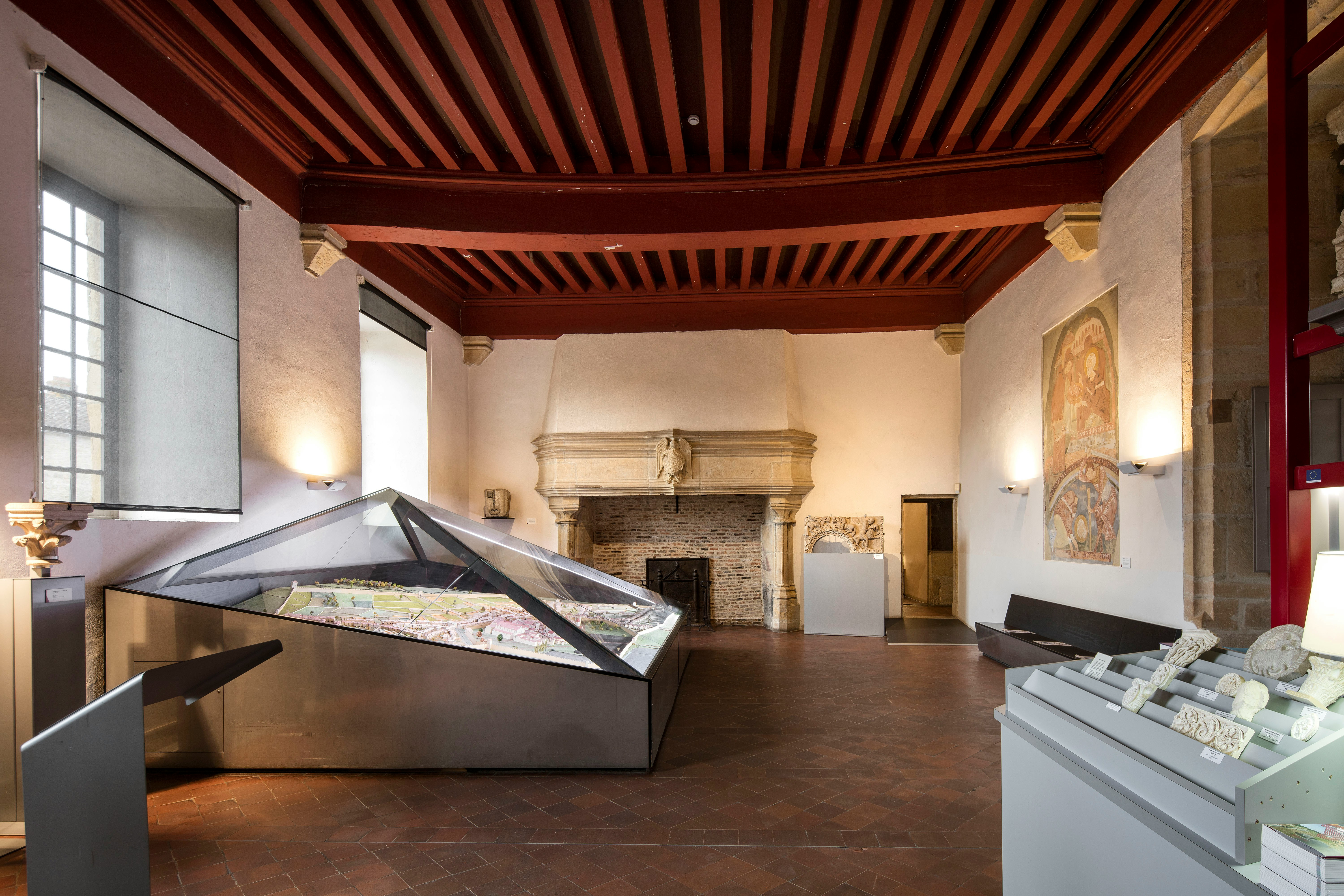 Abbaye de Cluny interior with historical artifacts and architectural details, Lyon, France.