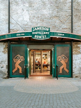 Entrance to Jameson Distillery Bow St. in Dublin, showcasing iconic signage and open doors.
