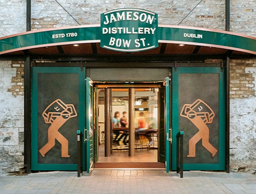 Entrance to Jameson Distillery Bow St. in Dublin, showcasing iconic signage and open doors.