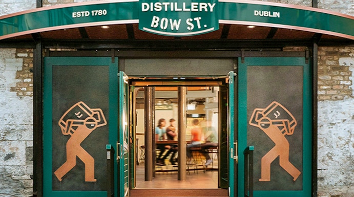Entrance to Jameson Distillery Bow St. in Dublin, showcasing iconic signage and open doors.