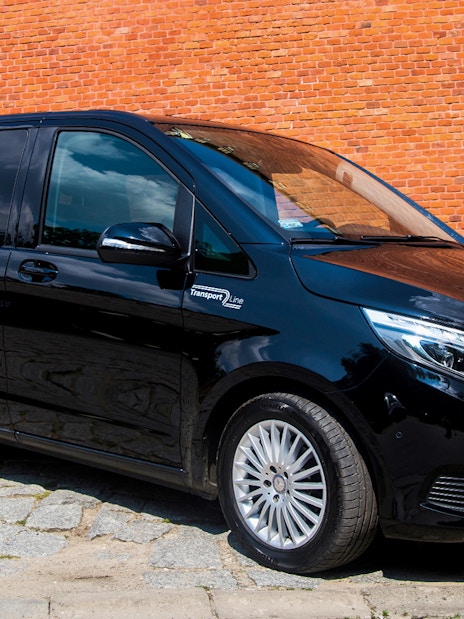 Black van for Krakow airport transfer service.