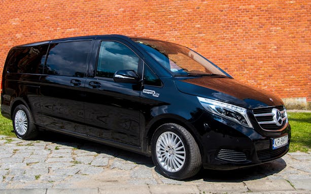 Black van for Krakow airport transfer service.