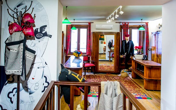 Bagella Brothers shop interior in Sassari with traditional clothing and decor.