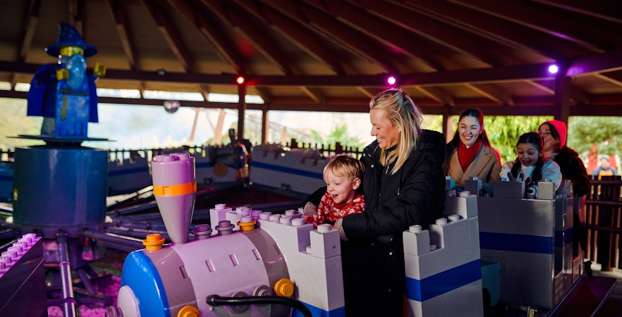 Guests enjoying a ride at Legoland Windsor during Christmas.