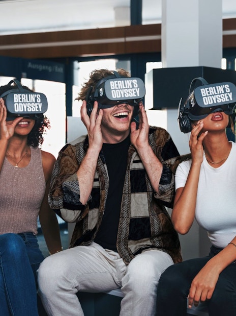 Visitors enjoying Berlin's Odyssey virtual reality experience, exploring 9 centuries of history.