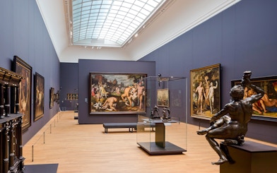 Rijksmuseum 17th century gallery with paintings and sculptures on display.