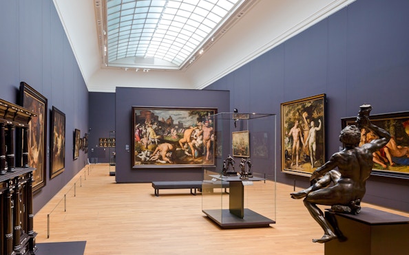 Rijksmuseum 17th century gallery with paintings and sculptures on display.