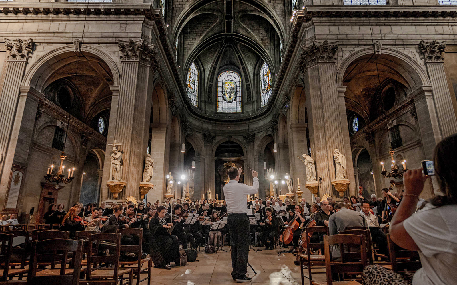Orchestra performing inside St Sulpice Church, Paris.