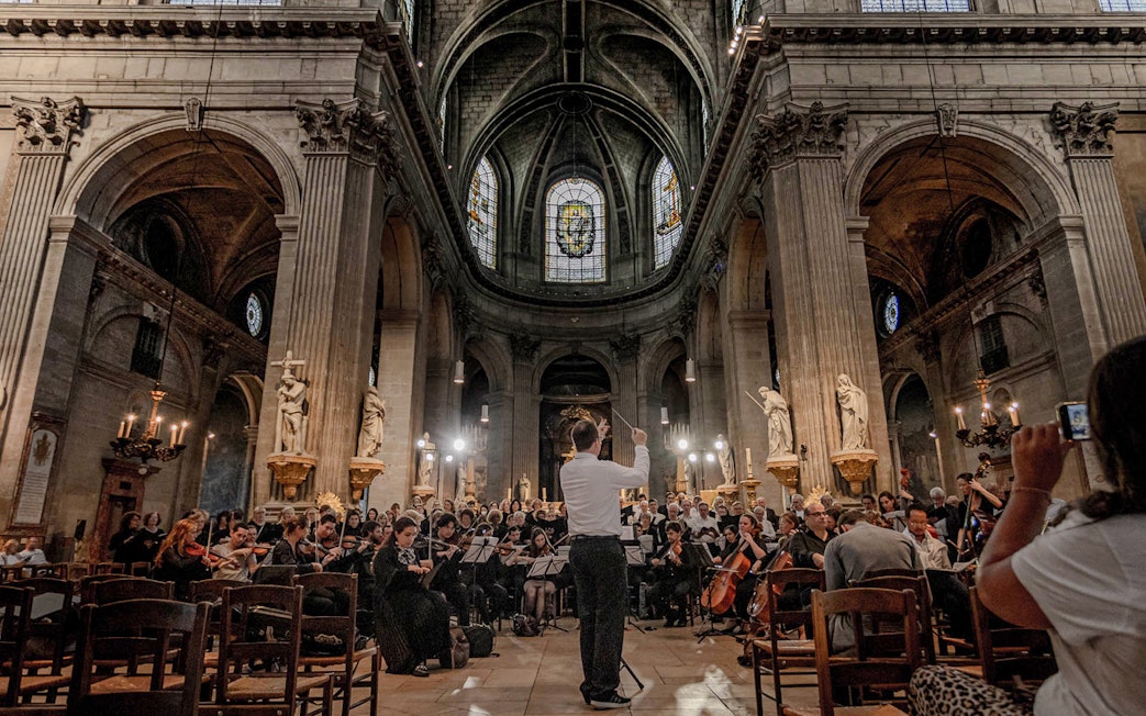 Orchestra performing inside St Sulpice Church, Paris.
