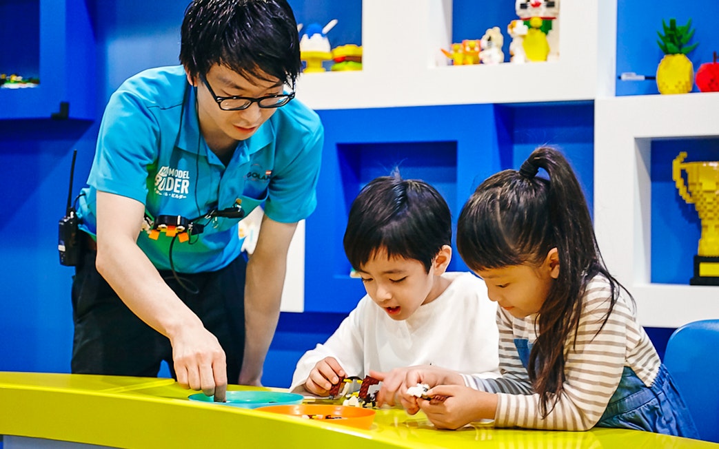 Children building with LEGO bricks at LEGOLAND Discovery Center Tokyo.