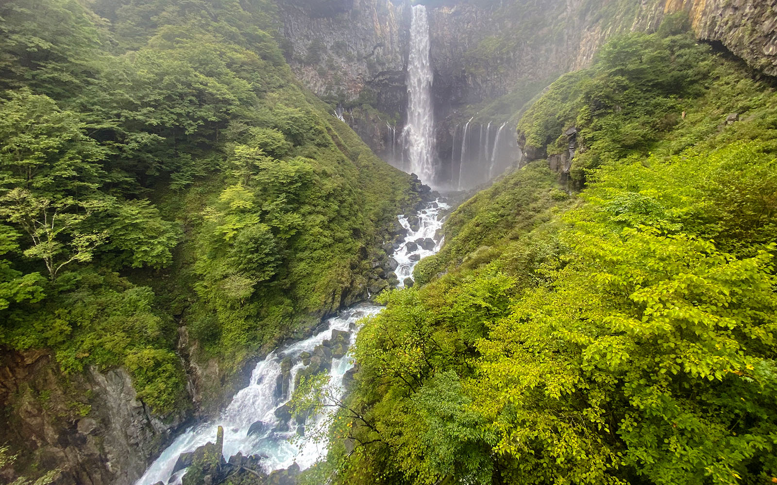 Kegon Falls cascading through lush greenery in Nikkō National Park, Japan.
