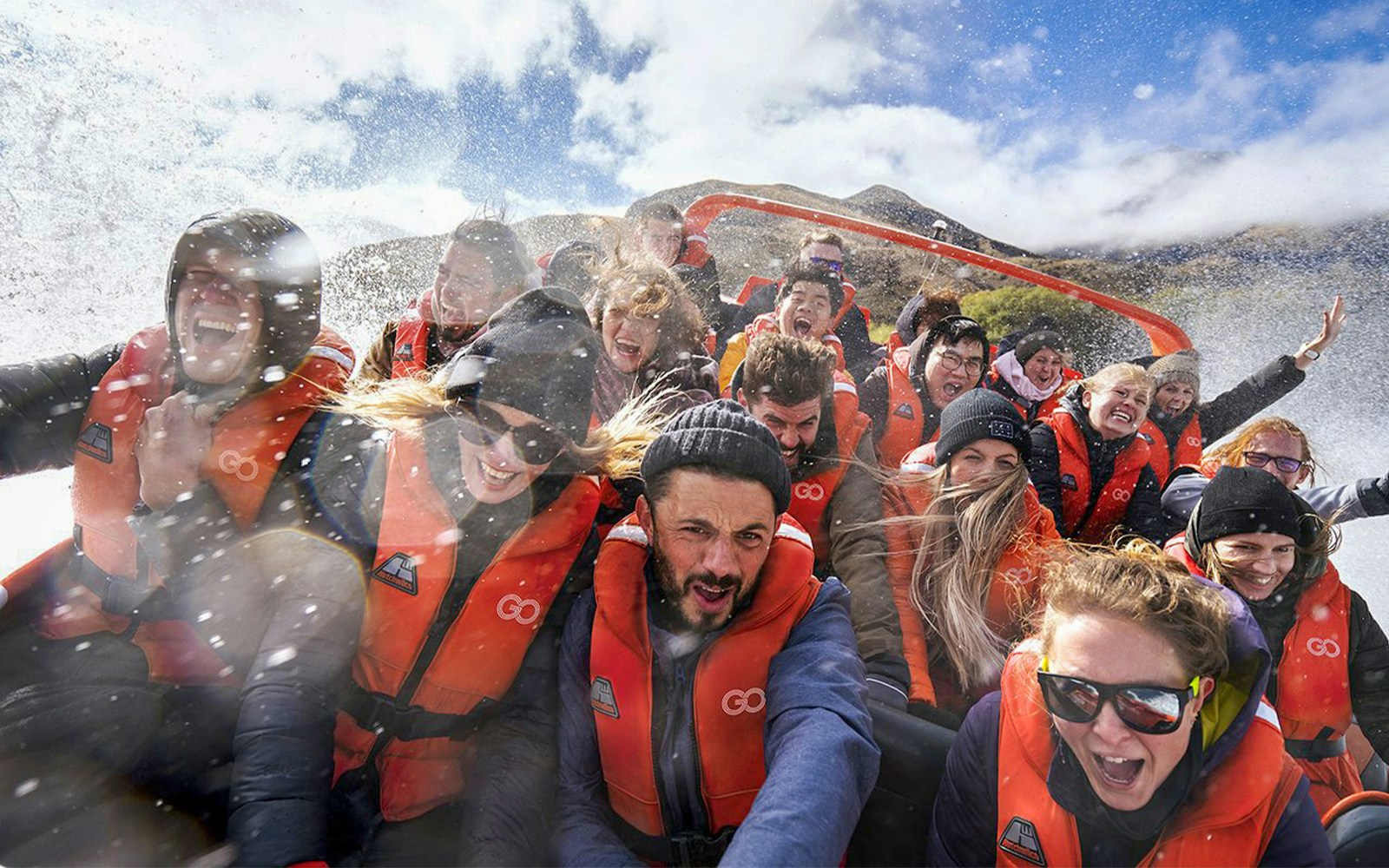 Group enjoying a thrilling jet boat ride on Kawarau River, New Zealand.