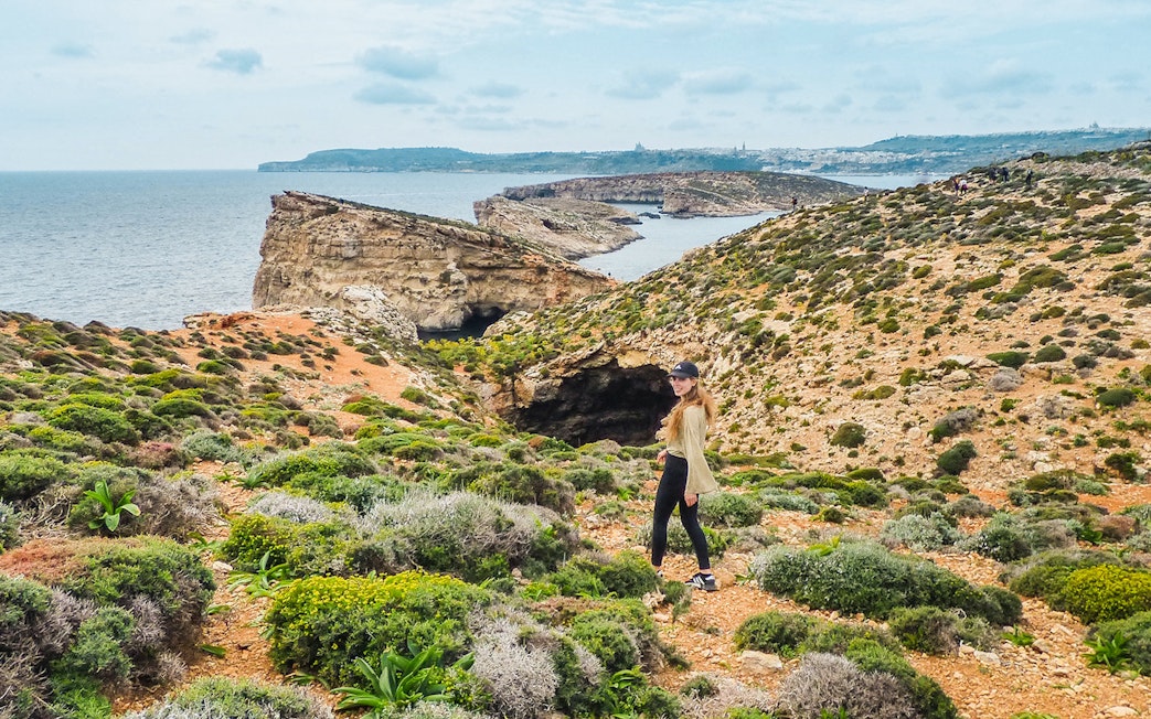 Cruise view of Gozo and Comino cliffs from Sliema on a Turkish Gulet tour.
