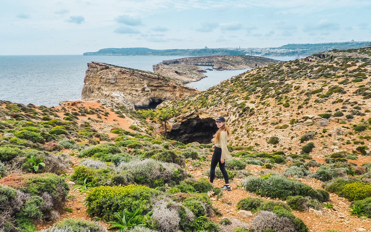 Cruise view of Gozo and Comino cliffs from Sliema on a Turkish Gulet tour.