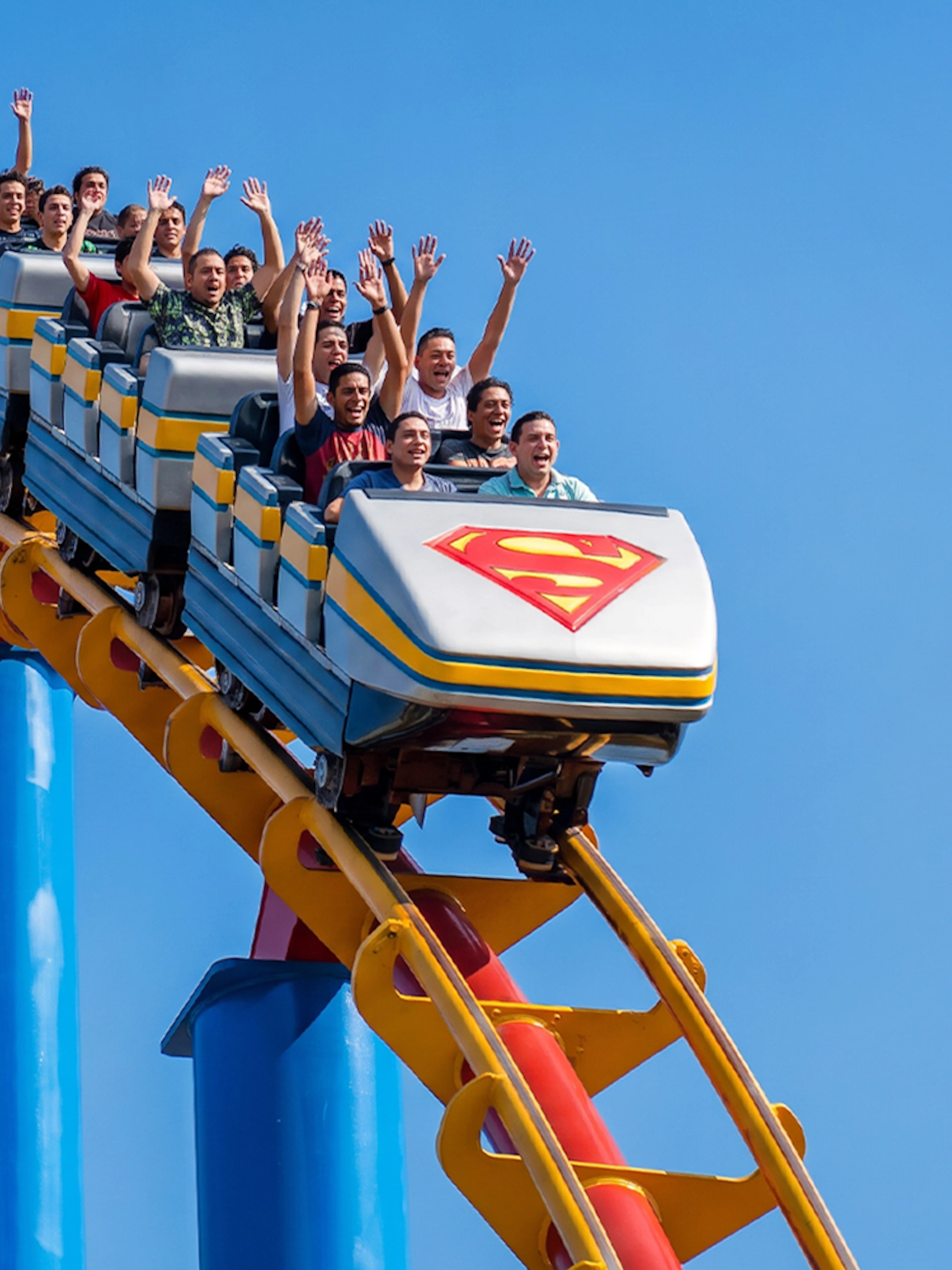 Superman Rollercoaster at Six Flags Mexico with riders on a steep drop.