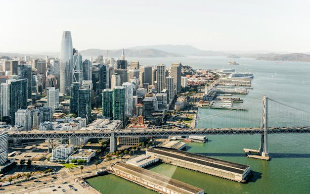 Midtown San Francisco skyline from Golden Gate helicopter tour with iconic bridge view.