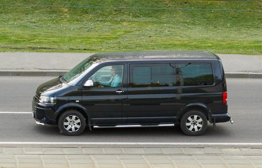 Minivan parked outside Harry Potter Studios Tokyo for transfer service.
