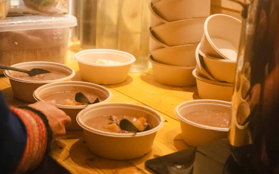 Bowls of traditional Sami stew served during Tromso Northern Lights tour.