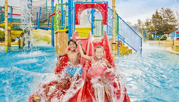 Children on a water ride at Caribe Aquatic Park, PortAventura, Spain.