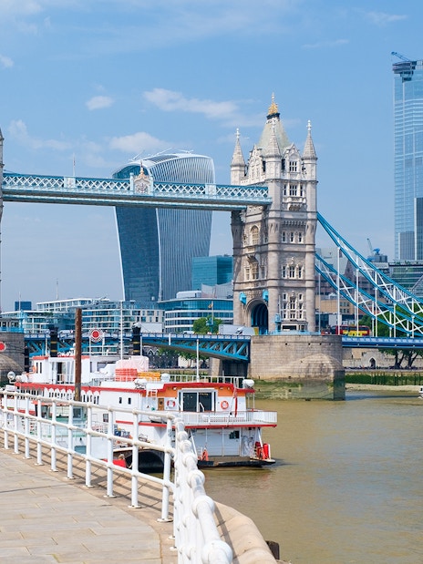 Tower Bridge and boats on the River Thames near London Tower Pier.