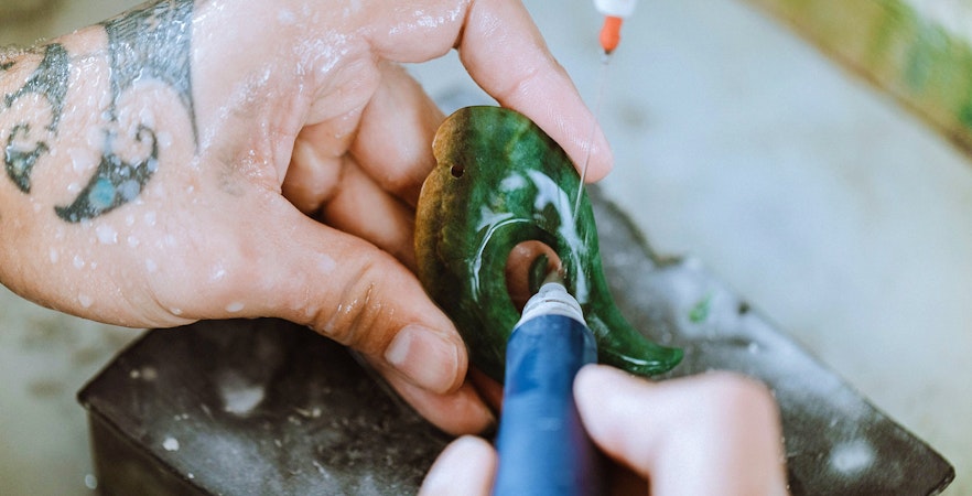 Jade carving demonstration during guided tour in Rotorua, New Zealand.