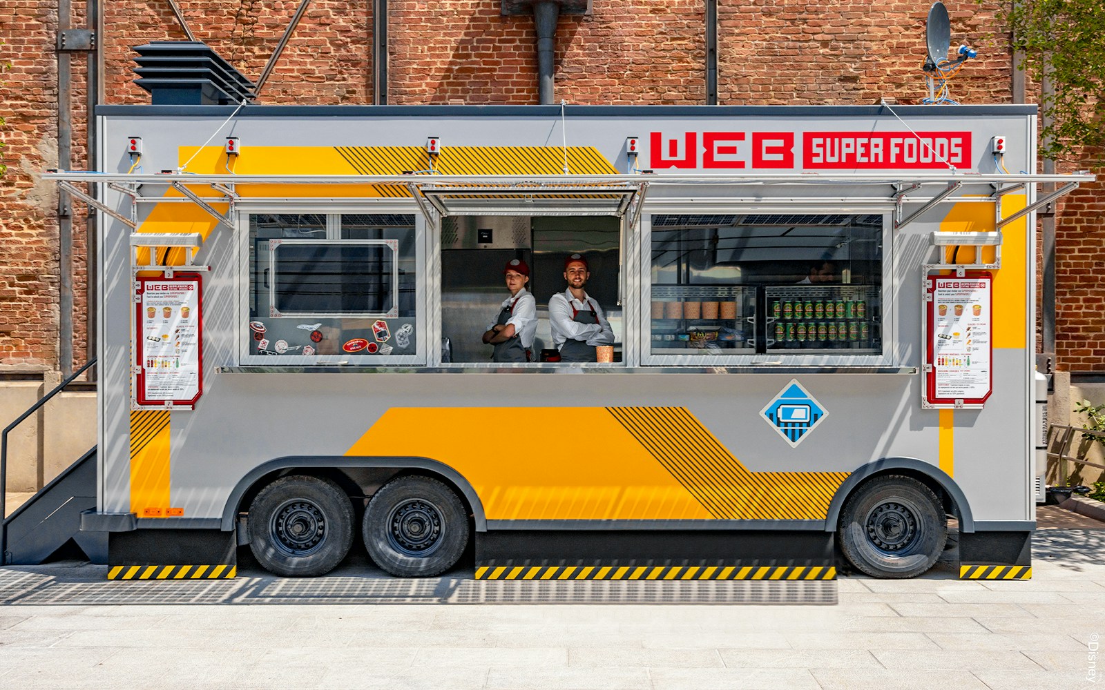 Disneyland Paris food truck serving visitors in park setting.