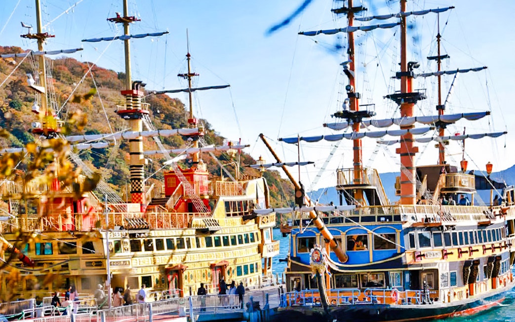 Hakone Pirate Ship on Lake Ashi, Japan, with scenic mountain backdrop.