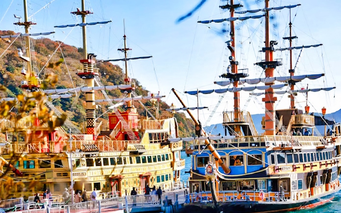 Hakone Pirate Ship on Lake Ashi, Japan, with scenic mountain backdrop.