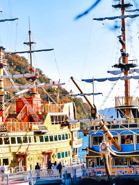 Hakone Pirate Ship on Lake Ashi, Japan, with scenic mountain backdrop.