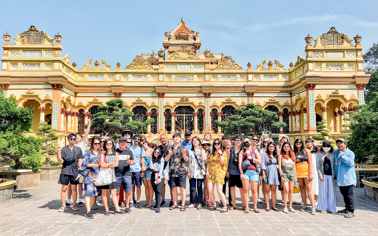 Tour group in front of Vinh Trang Pagoda, Mekong Delta Day Tour from Ho Chi Minh.