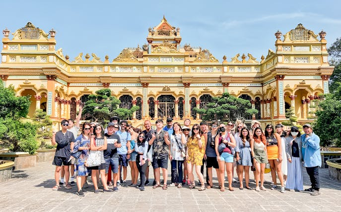 Tour group in front of Vinh Trang Pagoda, Mekong Delta Day Tour from Ho Chi Minh.