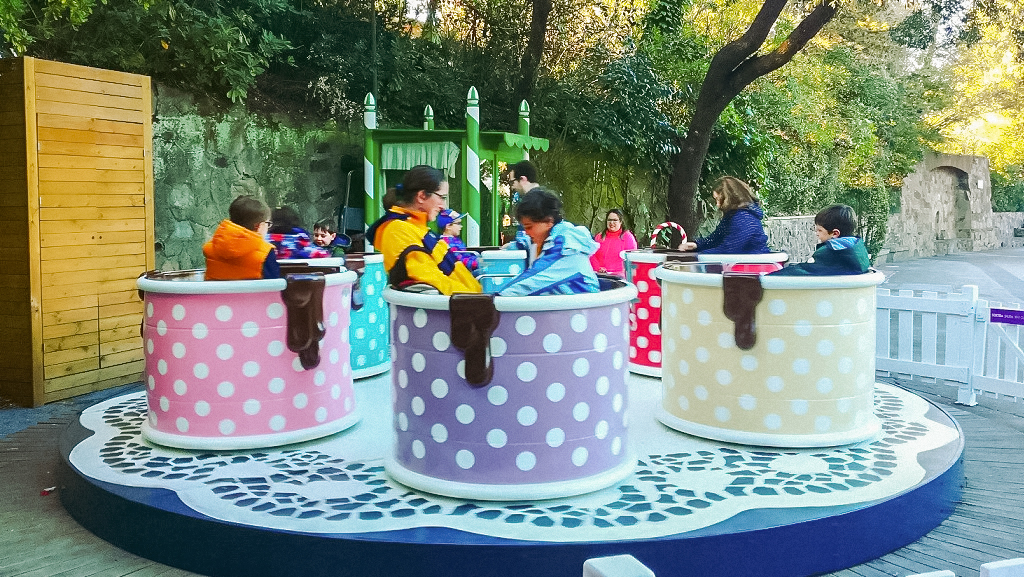 Children enjoying teacup ride at Tibidabo Amusement Park, Barcelona.